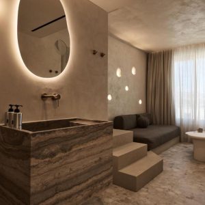 Terrazzo Granitech Medium resin microtopping on hotel bathroom and room walls, floor, and ceiling.